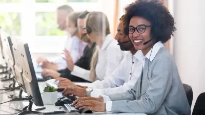 Persons working in a call center.